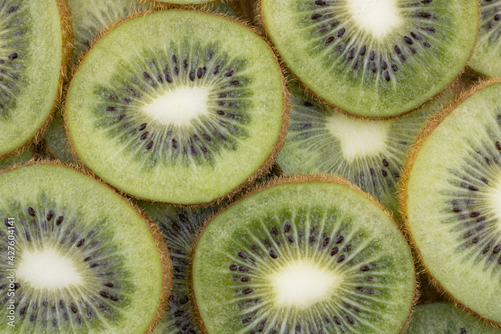 Sliced ripe kiwi slices close-up. Tropical fruit. Sliced ripe kiwi slices close-up. Tropical fruit.