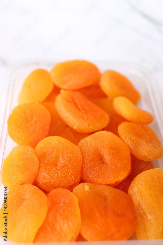 Dried apricots on white background with copy space. dried organic apricots. Dried apricots on white background with copy space. dried organic apricots.