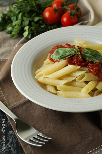 Concept of tasty food with pasta with tomato sauce, close up