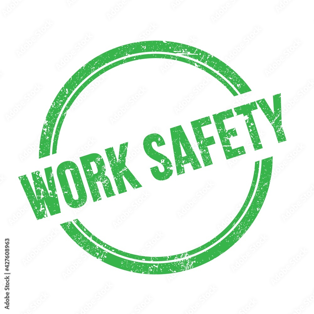 WORK SAFETY text written on green grungy round stamp. WORK SAFETY text written on green grungy round stamp.