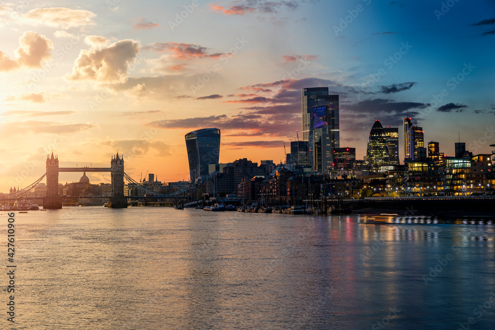 Sunset to night seamless view to the modern skyline of London, United Kingdom, with Tower Bridge and the City