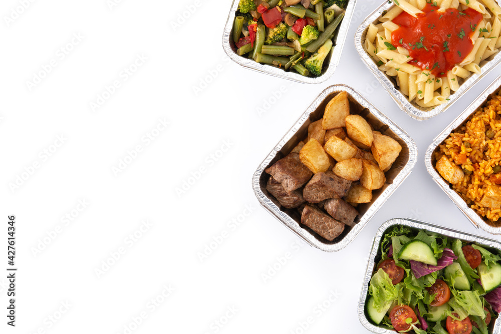 Take away healthy food in foil boxes isolated on white background. Top view. Copy space Take away healthy food in foil boxes isolated on white background. Top view. Copy space