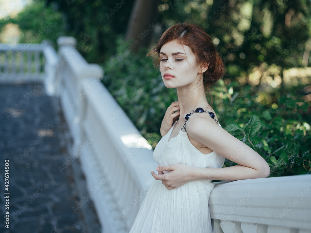 Attractive woman decorating luxury outdoor summer walk Attractive woman decorating luxury outdoor summer walk
