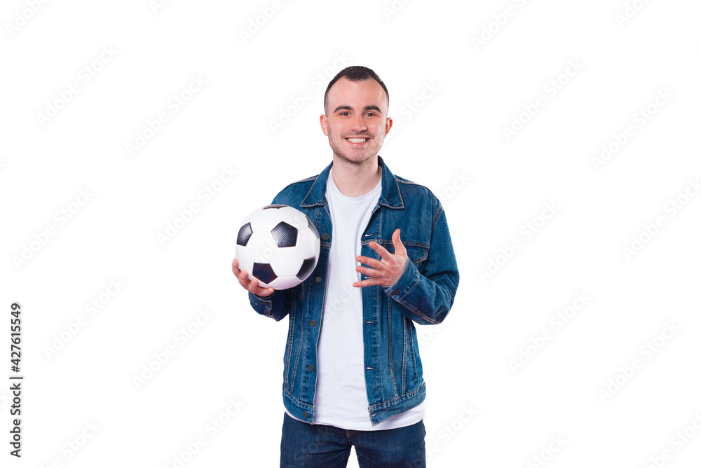 Photo of handsome young man holding soccer ball over white background