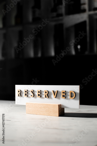 reserved sign on the table in the restaurant