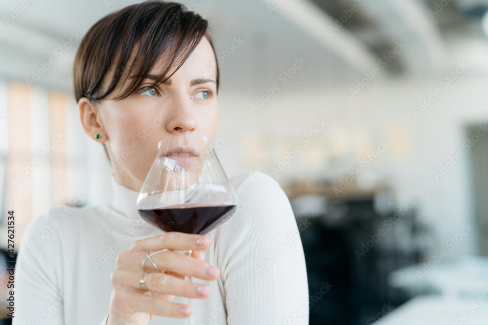 Elegant person with glass of wine Elegant person with glass of wine