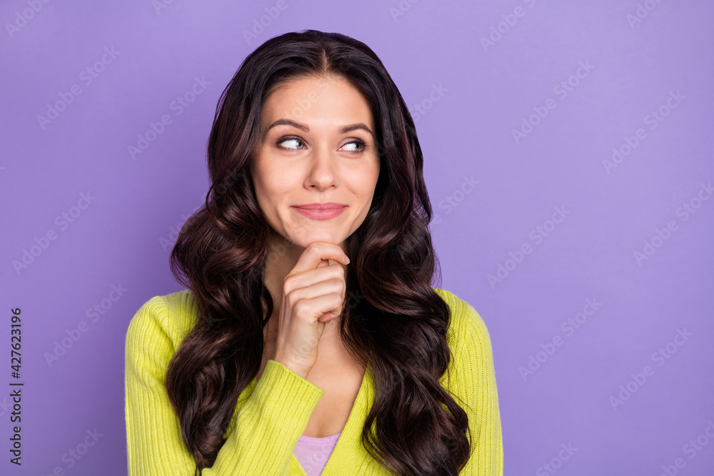 Photo portrait of pretty woman curious thoughtful looking blank space isolated on pastel violet color background Photo portrait of pretty woman curious thoughtful looking blank space isolated on pastel violet color background
