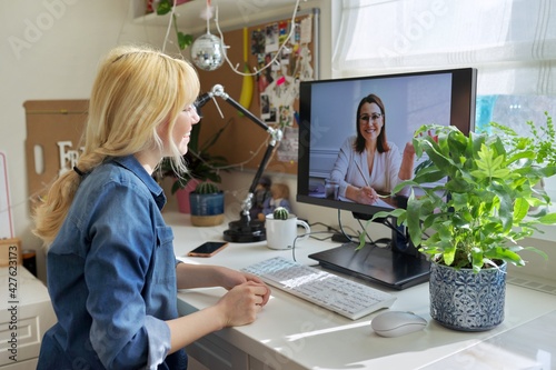 Teen girl talking online with psychologist, social worker