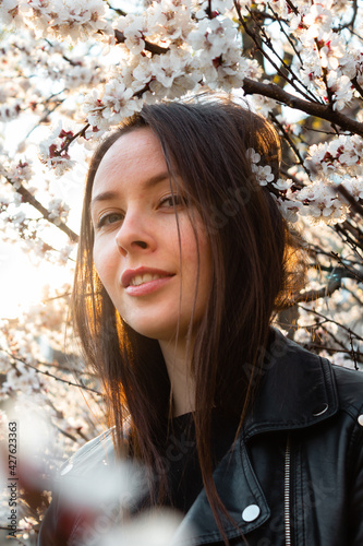 photo of a girl near the cherry blossoms
