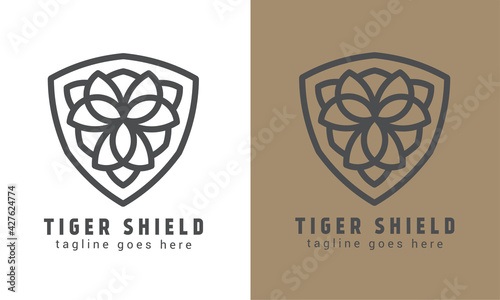 Luxury tiger shield vector logo template. symmetrical line art logotype. monogram logo design