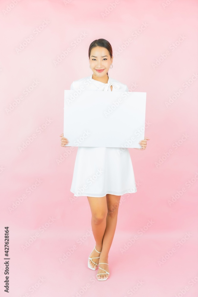 Portrait beautiful young asian woman with empty white billboard Portrait beautiful young asian woman with empty white billboard