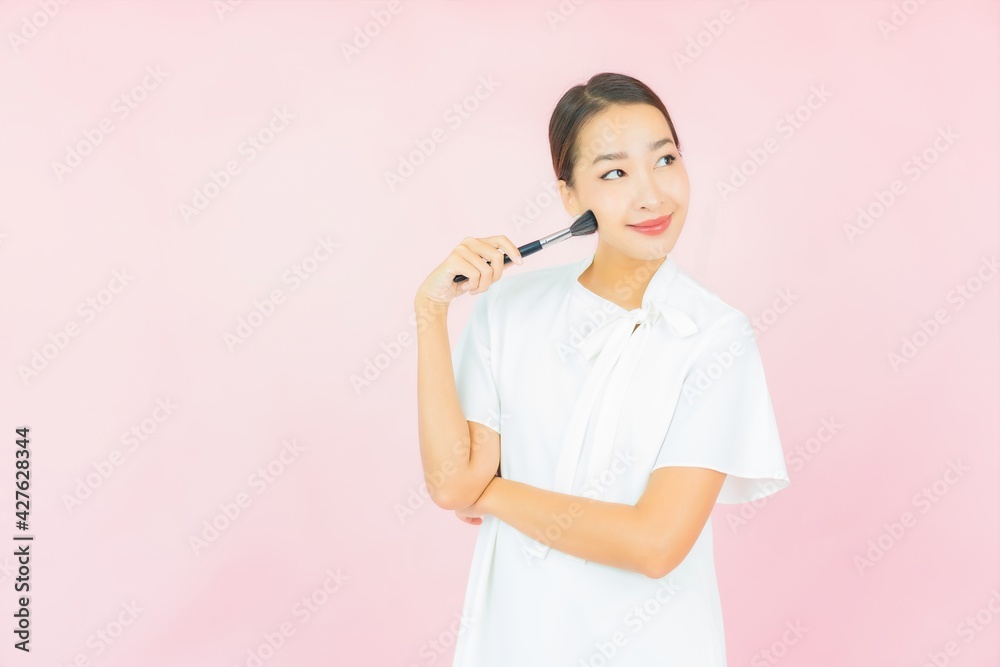 Portrait beautiful young asian woman with make up brush Portrait beautiful young asian woman with make up brush