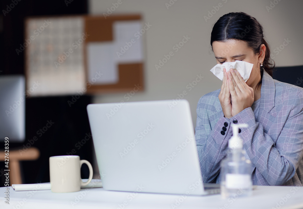 Sick, ill unhealthy female employee coughing or sneezing while working in workplace in office. Spreading and risk of corona virus covid-19 in workplace. Sick, ill unhealthy female employee coughing or sneezing while working in workplace in office. Spreading and risk of corona virus covid-19 in workplace.