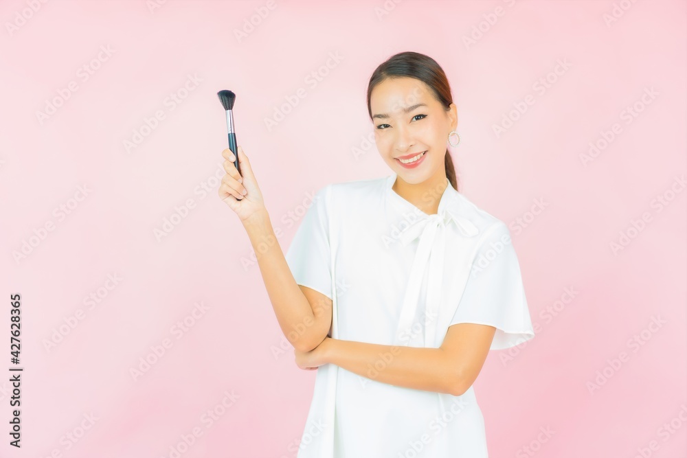 Portrait beautiful young asian woman with make up brush Portrait beautiful young asian woman with make up brush