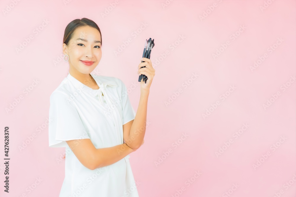 Portrait beautiful young asian woman with make up brush Portrait beautiful young asian woman with make up brush