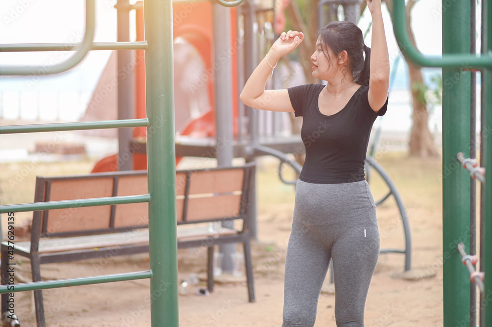 Pregnant women exercise on the playground