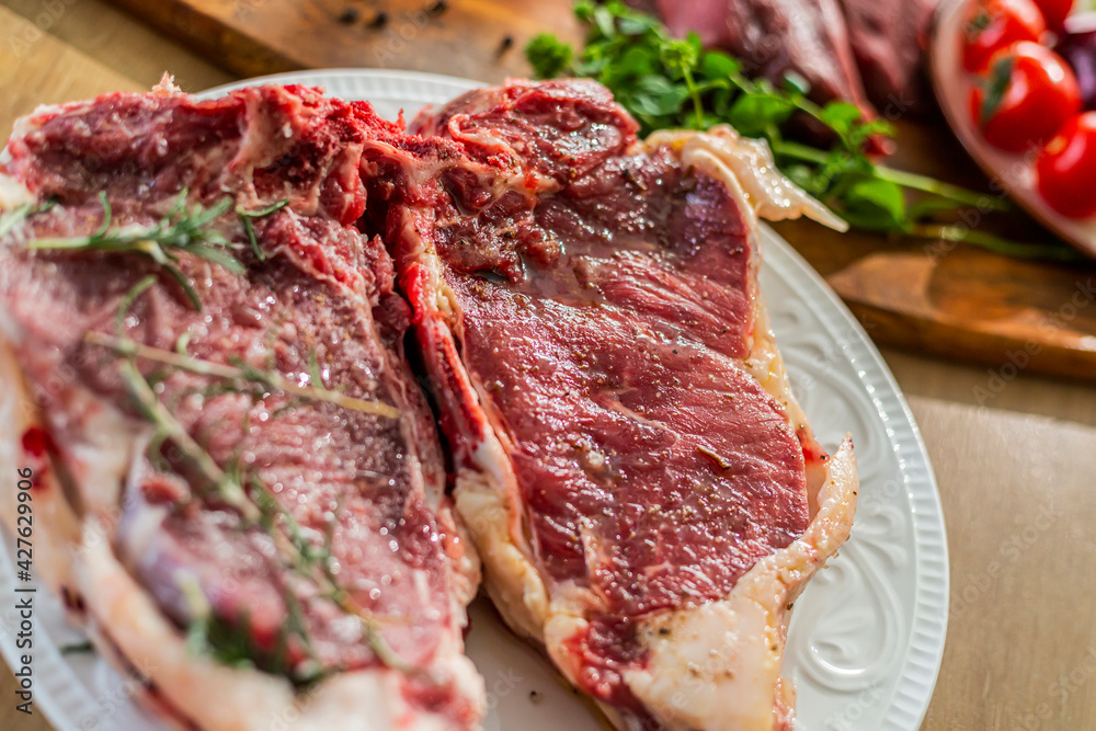 A close-up view of the meat steak ready for grill. A close-up view of the meat steak ready for grill.