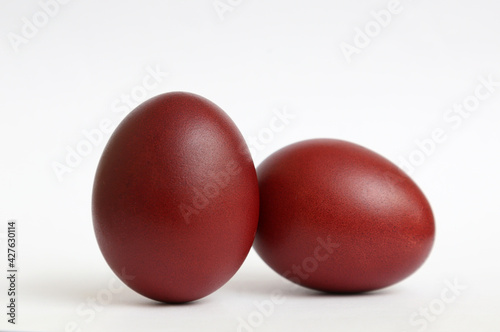 Easter red eggs on the white background.