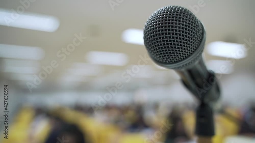Microphone at lecture room or study classroom with Asian students taking an exam