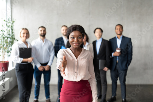 Black Business Lady Stretching Hand For Handshake In Office