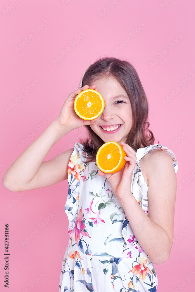 Beauty Model Girl takes Juicy Oranges. Beautiful Joyful teen girl with freckles, funny red hairstyle and yellow makeup. Professional make up. Orange Slice. Beauty Model Girl takes Juicy Oranges. Beautiful Joyful teen girl with freckles, funny red hairstyle and yellow makeup. Professional make up. Orange Slice.