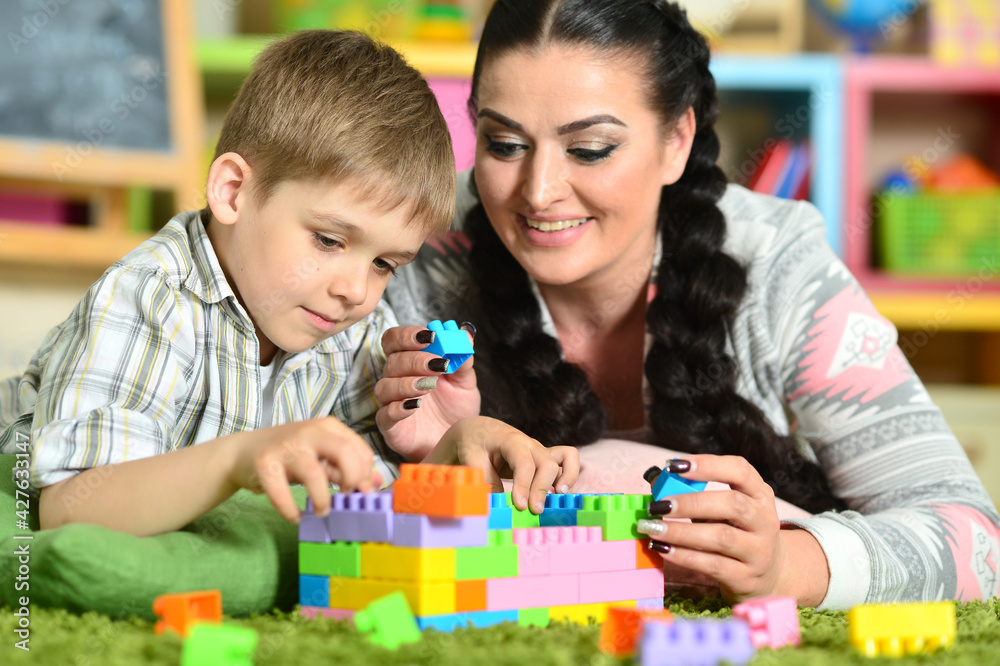 Young mother playing with cute little son Young mother playing with cute little son