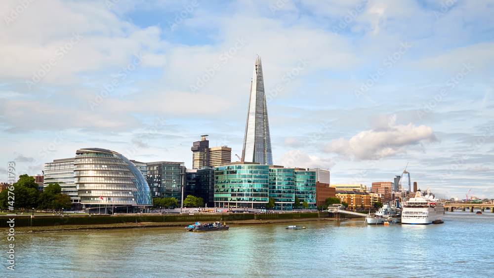 London, South Bank Of The Thames on a bright day in Summer. Panoramic image taken from the Tower Bridge.