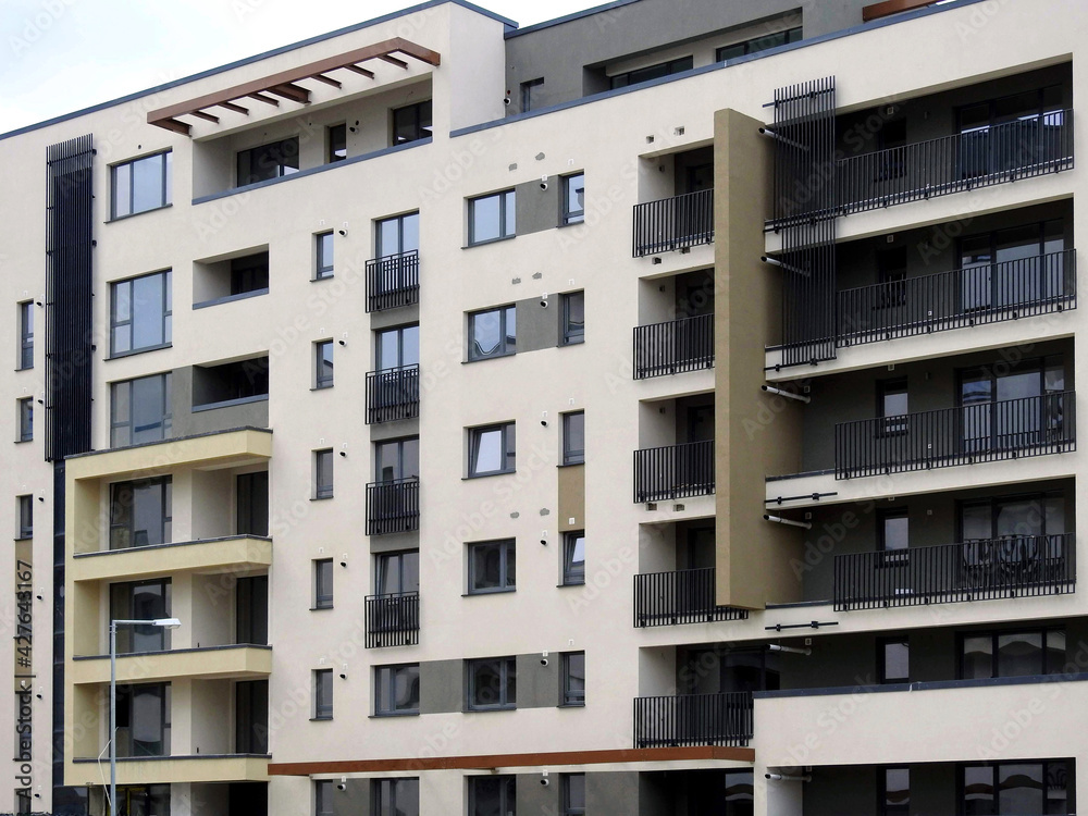 Architectural details of a modern high-rise apartment building with balconies and lodges Architectural details of a modern high-rise apartment building with balconies and lodges