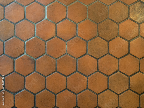 Closeup image of old hexagonal clay tiles background. Vintage floor tiles pattern.