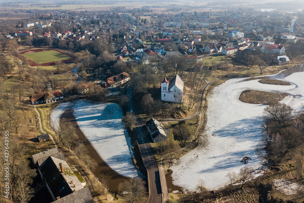 Aerial view of Aizpute lutheran church, Latvia.