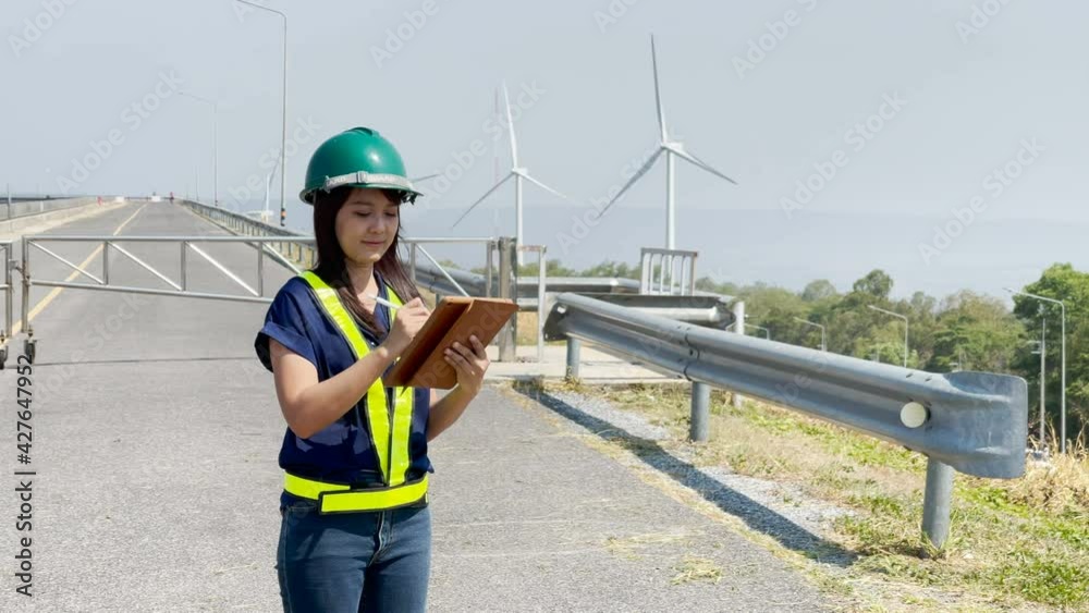 custom made wallpaper toronto digitalAsian woman engineers are checking and submitting reports outdoors on site power plant energy wind turbines