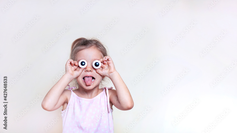 Girl with big eyes shows language