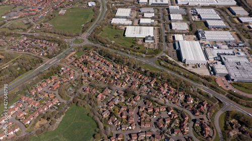 Aerial photo of the village of Caldecotte in Milton Keynes UK showing a typical British housing estate on a sunny summers day taken with a drone from above