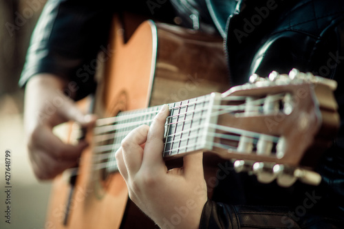 child playing guitar close-up of hands