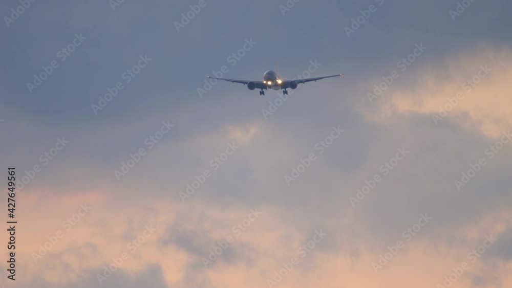 Airplane on the background of the sunset sky Airplane on the background of the sunset sky