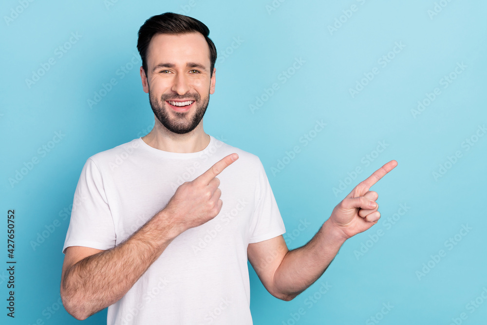 Portrait of attractive cheerful guy showing copy empty space way direction offer isolated over blue bright pastel color background Portrait of attractive cheerful guy showing copy empty space way direction offer isolated over blue bright pastel color background