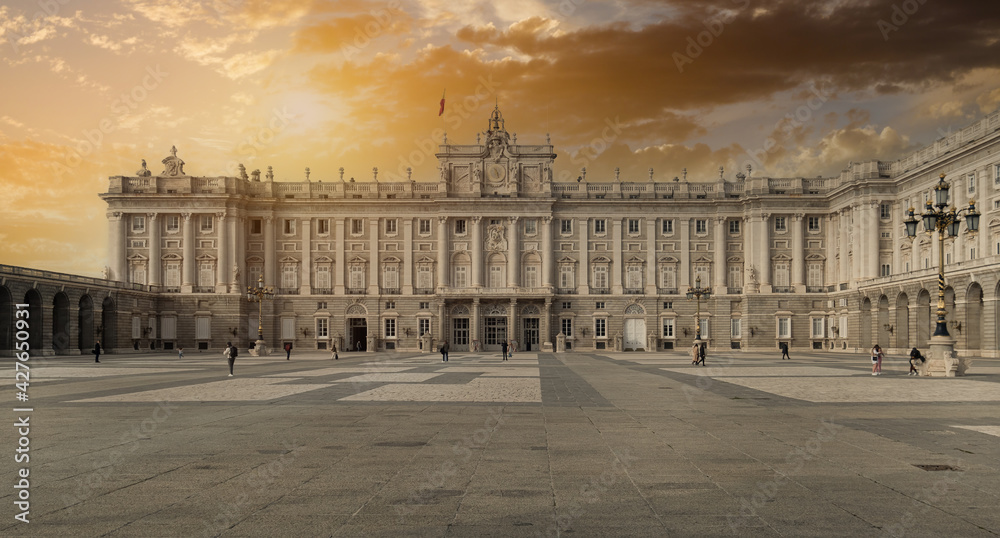 The Royal Palace of Madrid building against sunset. Spain