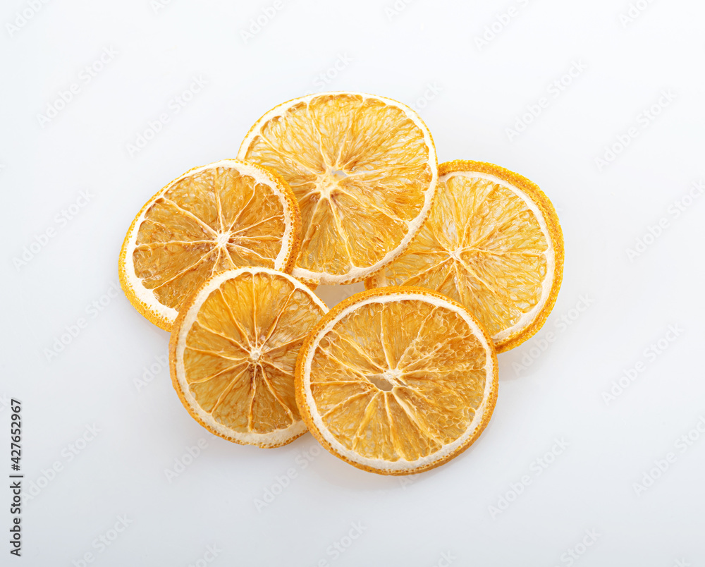 Round slices of dried orange, isolated on a white background Round slices of dried orange, isolated on a white background