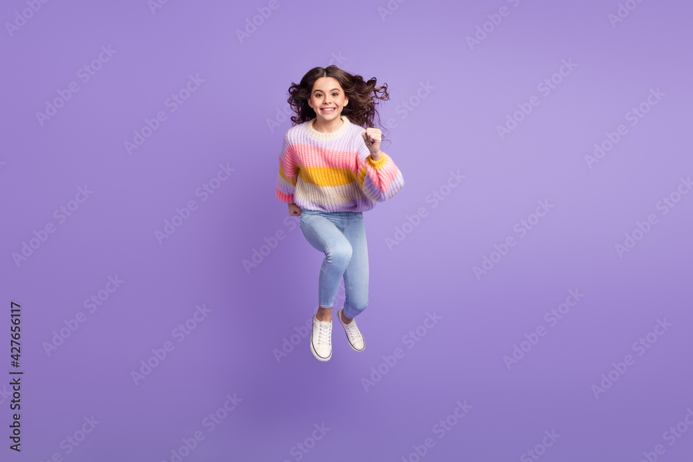 Full size photo of young happy cheerful smiling little girl running fast speed in air isolated on violet color background