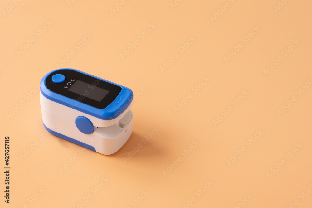 Pulse Oximeter, finger digital device to measure person's oxygen saturation. Reduced oxygenation is an emergency sign of pneumonia caused by flu or novel coronavirus. Pulse Oximeter, finger digital device to measure person's oxygen saturation. Reduced oxygenation is an emergency sign of pneumonia caused by flu or novel coronavirus.