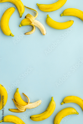 Half peeled banana with other fruits. Top view