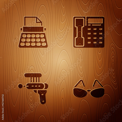 Set Glasses, Retro typewriter, Ray gun and Telephone handset on wooden background. Vector