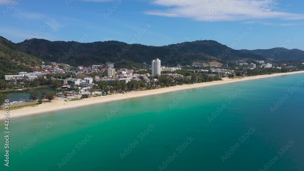 PHUKET, THAILAND. Beach and city in sunset time. Aerial view shot of drone in sunset time. Nature and travel concept. PHUKET, THAILAND. Beach and city in sunset time. Aerial view shot of drone in sunset time. Nature and travel concept.