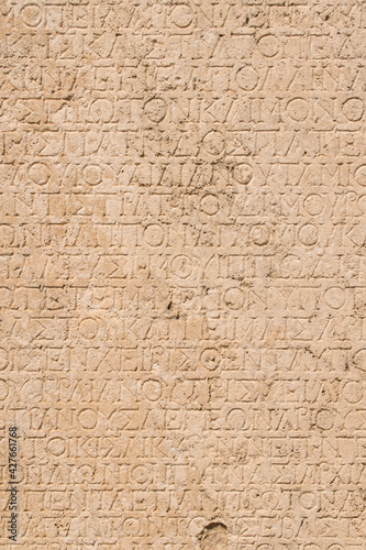 Stone background with antique greek inscriptions 