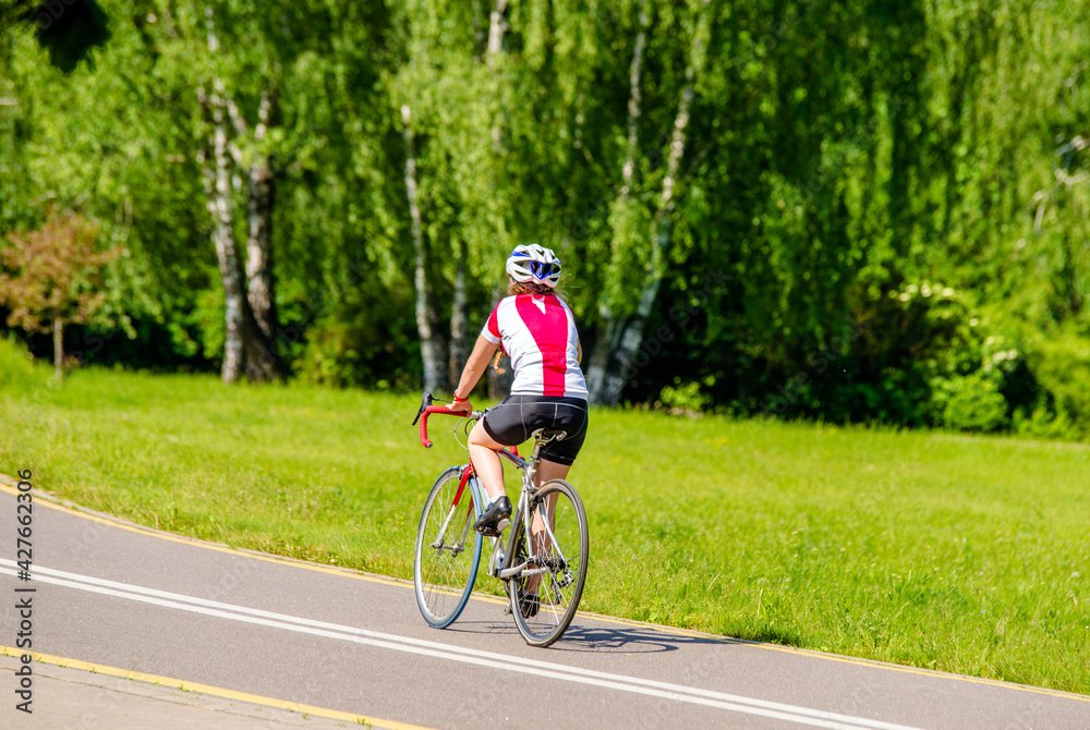 Cyclist ride on the bike path in the city Park
