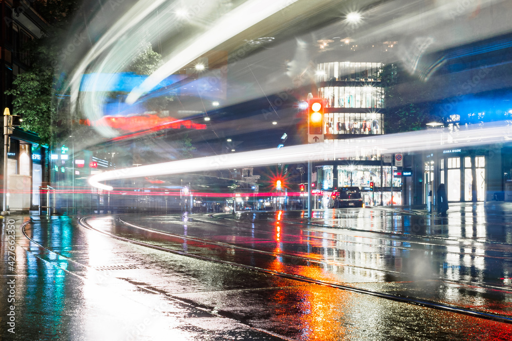 Night lights at shopping street Bahnhofstrasse with tram in Zurich, Switzerland