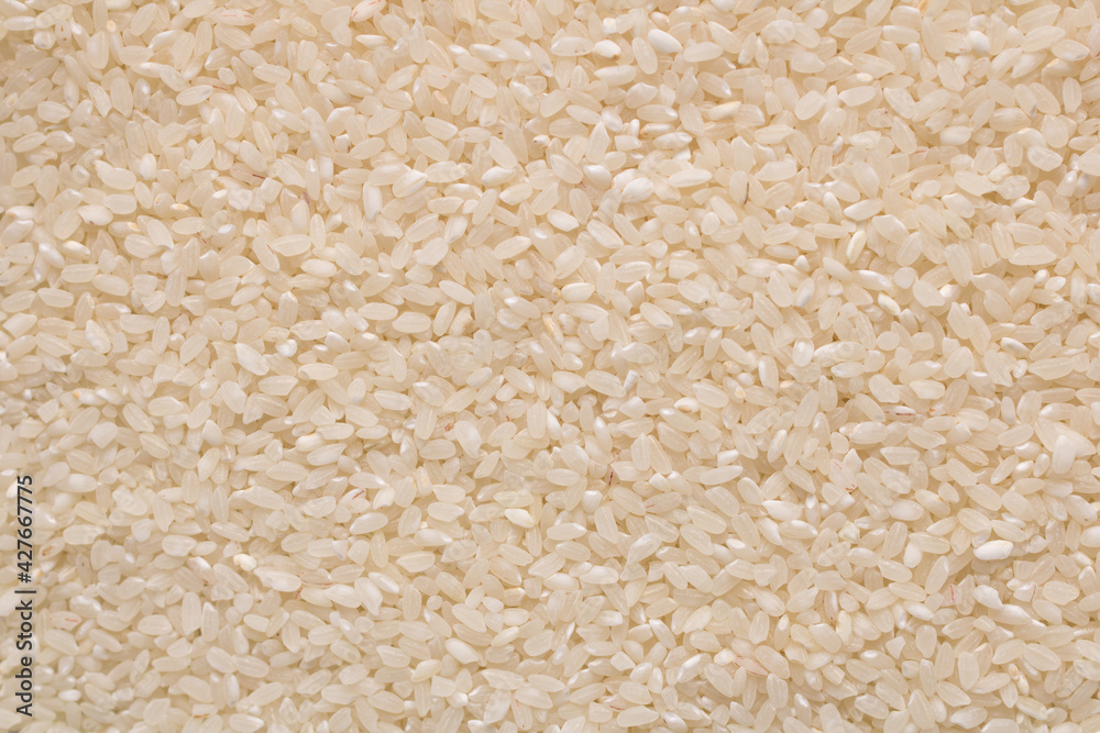 Raw white rice grain food background. Healthy eating. Top view. Raw white rice grain food background. Healthy eating. Top view.