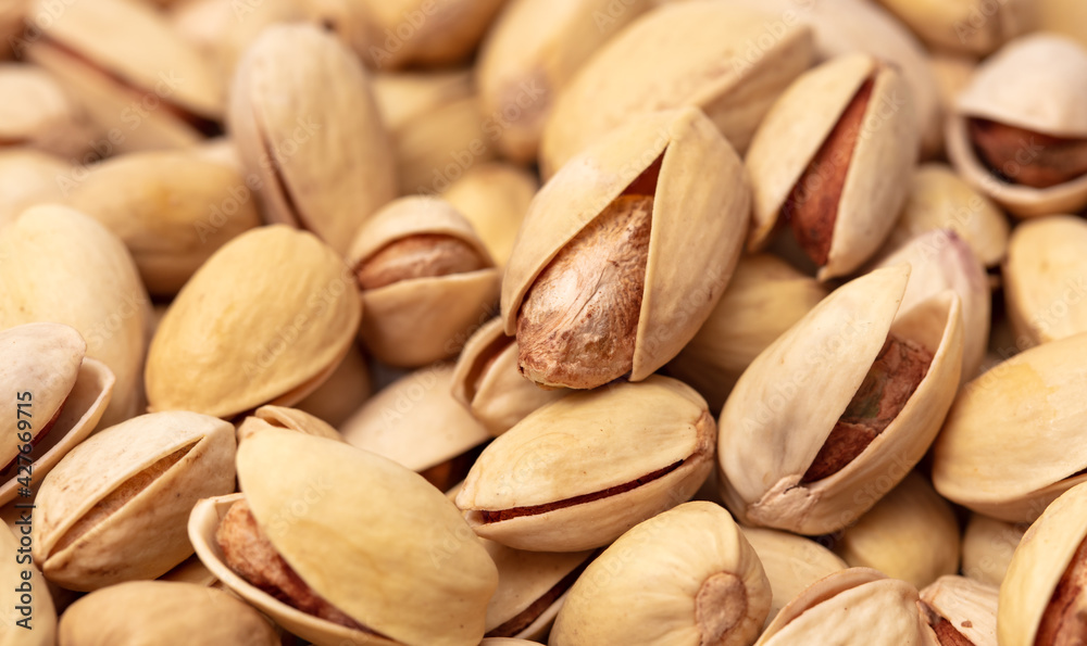 Close-up of fresh pistachio nuts as background. Close-up of fresh pistachio nuts as background.
