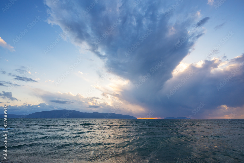 Fototapeta premium beautiful clouds with the setting sun over the sea