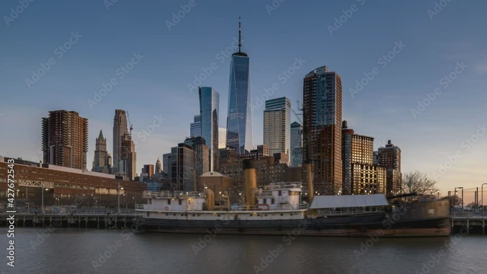 Day to Night Timelapse Sunset Clouds Moving Over One World Trade Center POV view from Pier 25 in TriBeCa District Day to Night Timelapse Sunset Clouds Moving Over One World Trade Center POV view from Pier 25 in TriBeCa District